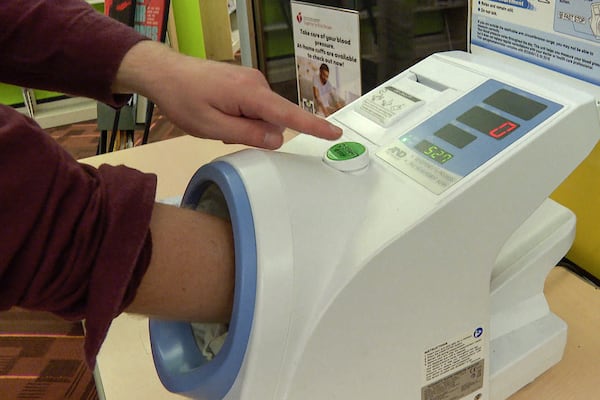 A free blood pressure machine is used at the public library in Kansas City, Mo., on Nov. 19, 2024. (AP Photo/Nick Ingram)