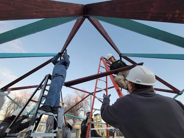 An AmeriCorps team works on a greenhouse in Casper, Wyoming, in 2024 for the Casper Housing Authority, a nonprofit organization that relies on the now-suspended program. (AP via Jamie Purcell)