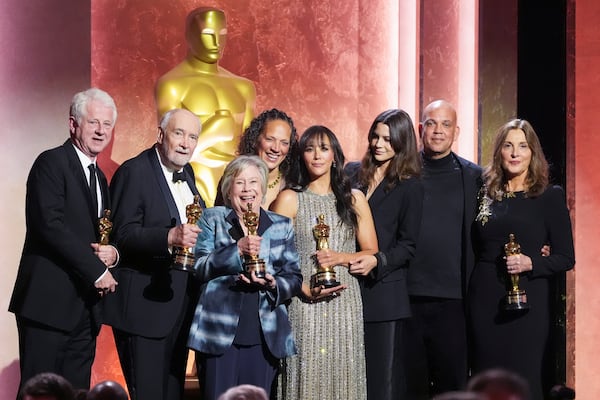 Richard Curtis, from left, Michael G. Wilson, Juliet Taylor, Martina Jones, Rashida Jones, Kenya Kinski-Jones, Quincy Jones III, and Barbara Broccoli pose with their awards during the 15th Governors Awards on Sunday, Nov. 17, 2024, at The Ray Dolby Ballroom in Los Angeles. (AP Photo/Chris Pizzello)