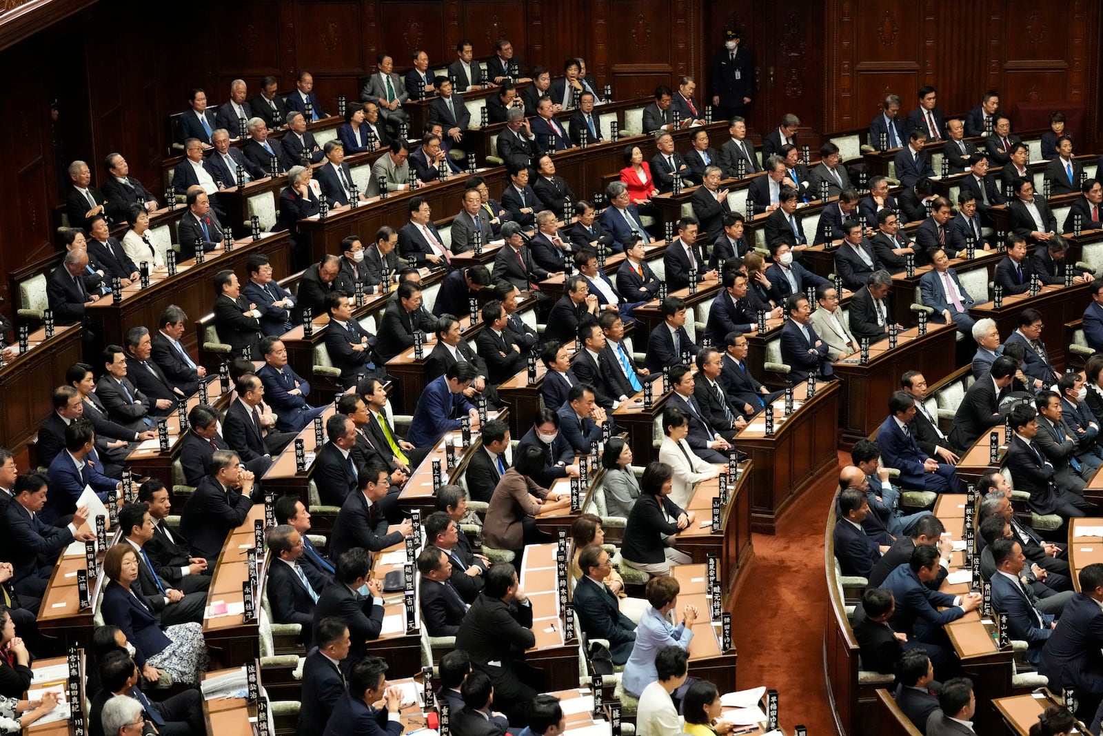 Lawmakers wait for the start of the extraordinary session at parliament's lower house Tuesday, Oct. 1, 2024, in Tokyo. (AP Photo/Eugene Hoshiko)