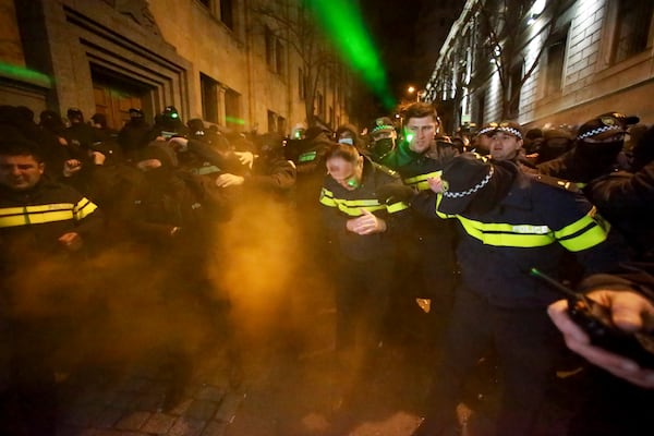 Police block protesters pouring into the streets following Georgian Prime Minister Irakli Kobakhidze's announcement, rallying outside the parliament building in Tbilisi, Georgia, on Friday, Nov. 29, 2024. (AP Photo/Zurab Tsertsvadze)