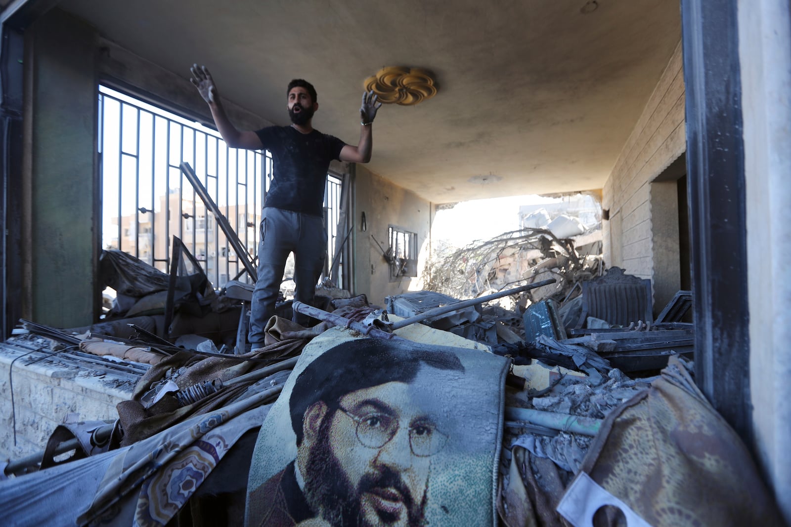 A man reacts in a damaged apartment at the site of an Israeli airstrike in Saksakieh, south Lebanon, Thursday, Sept. 26, 2024. (AP Photo/Mohammed Zaatari)