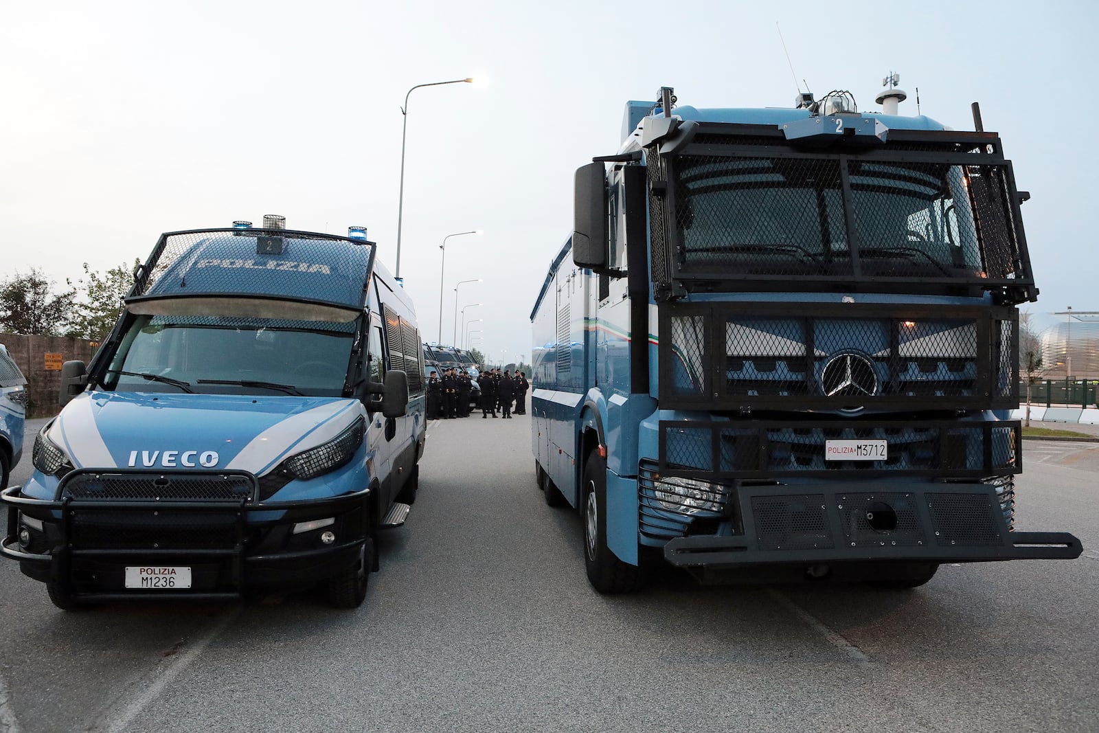 Police vehicles patrol the area of the Bluenergy stadium ahead of the Nations League soccer match between Italy and Israel, in Udine, Italy, Monday, Oct. 14, 2024. (Andrea Bressanutti/LaPresse via AP)