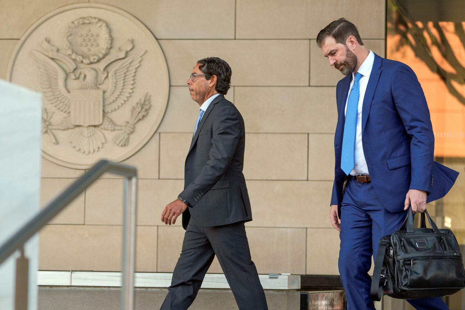 Dr. Mark Chavez, left, a physician from San Diego, who is charged in connection with Matthew Perry's fatal overdose, walks out of the United States Courthouse with his with his defense attorney Matthew Binninger after pleading guilty to conspiring to distribute the surgical anesthetic ketamine in Los Angeles on Wednesday, Oct. 2, 2024. (AP Photo/Damian Dovarganes)