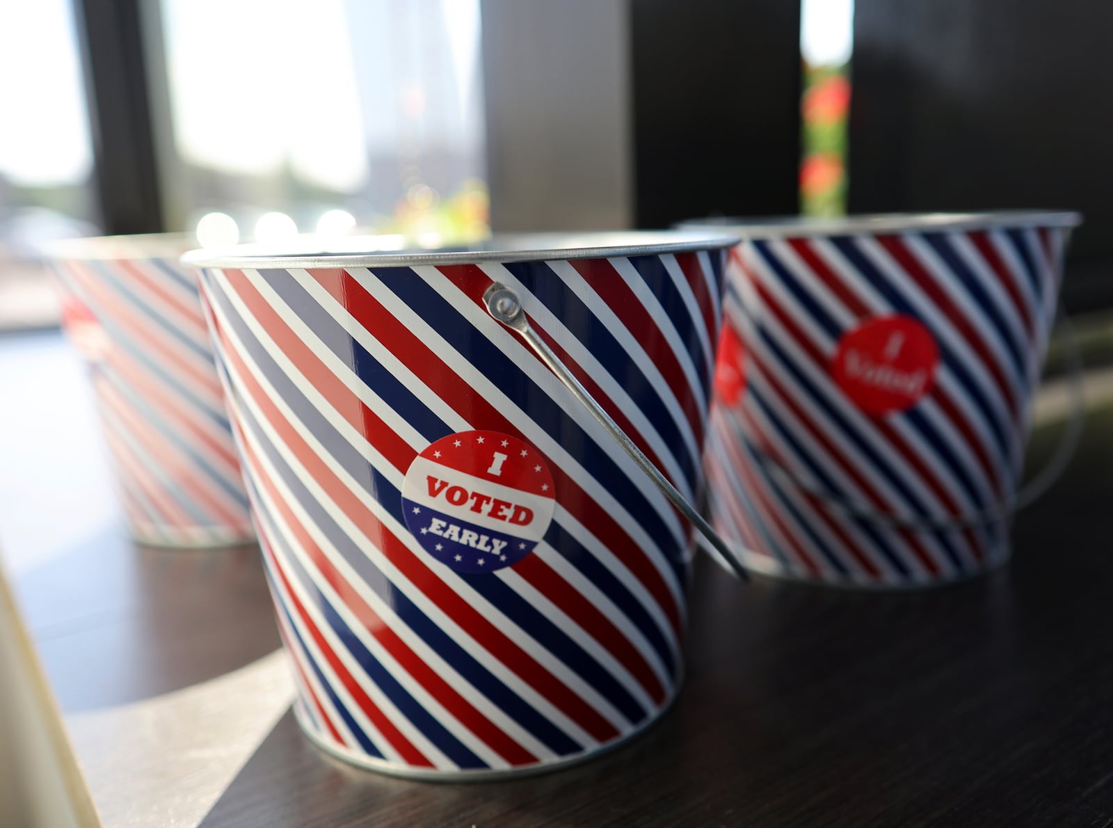 "I Voted Early" stickers sit in a bucket by the ballot box at the City of Minneapolis early voting center, Thursday, Sept. 19, 2024, in St. Paul, Minn. In-person voting in the 2024 presidential contest begins Friday in three states, including Democratic vice presidential candidate Tim Walz's home state of Minnesota, with just over six weeks left before Election Day. (AP Photo/Adam Bettcher)