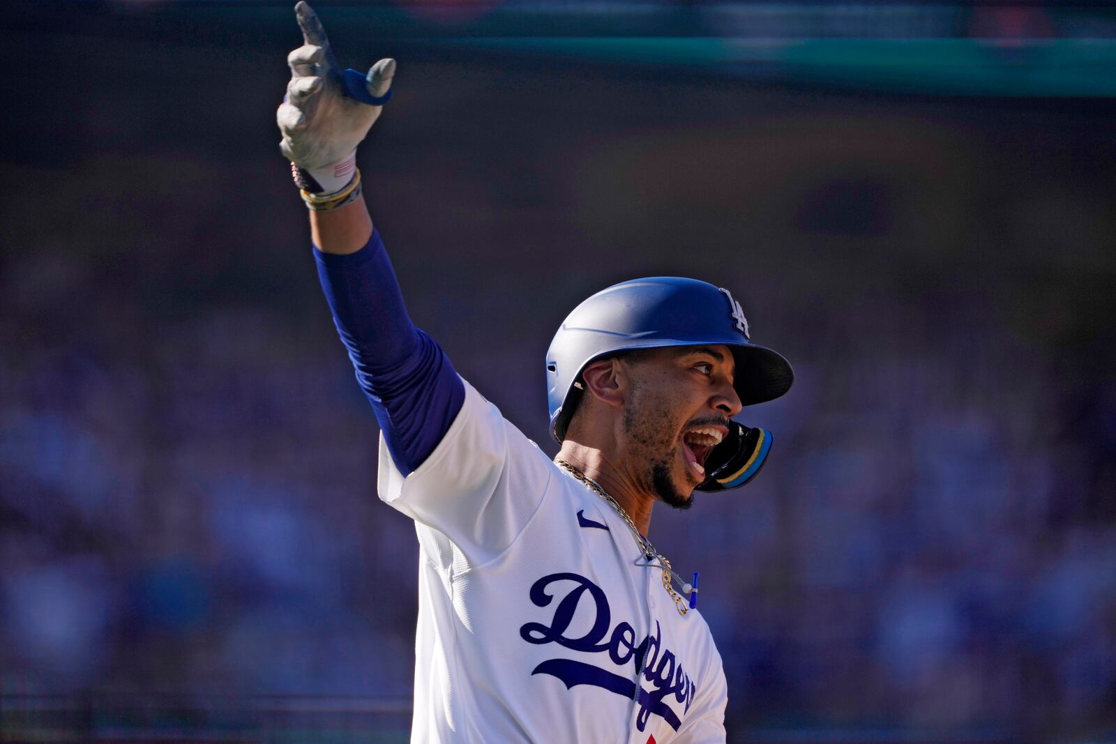 Los Angeles Dodgers' Mookie Betts celebrates after hitting a walk-off solo home run during the ninth inning of a baseball game against the Colorado Rockies, Sunday, Sept. 22, 2024, in Los Angeles. The Dodgers won 6-5. (AP Photo/Mark J. Terrill)