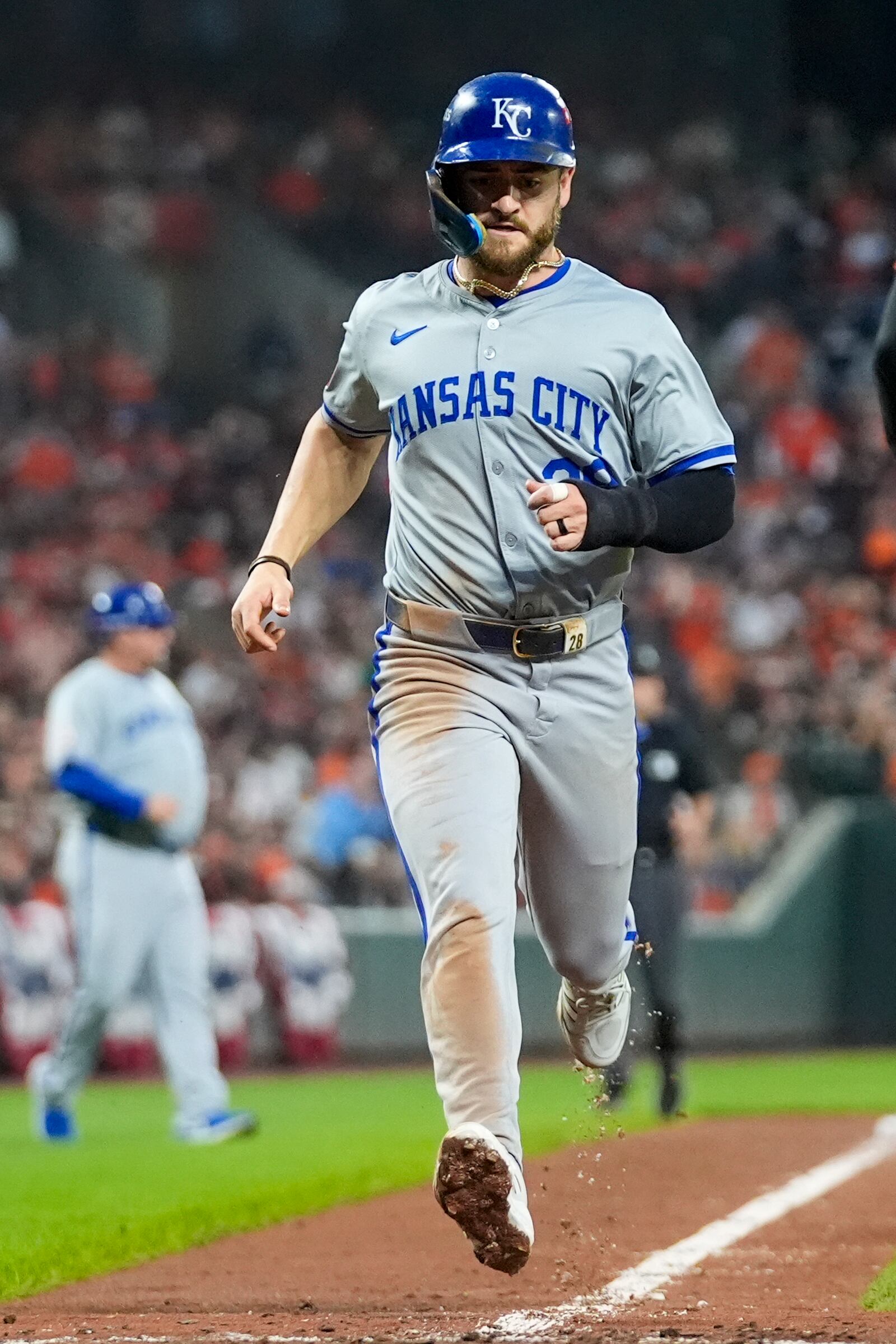 Kansas City Royals' Kyle Isbel scores on an infield single by Bobby Witt Jr. during the sixth inning in Game 2 of an AL Wild Card Series baseball game against the Baltimore Orioles, Wednesday, Oct. 2, 2024 in Baltimore. (AP Photo/Stephanie Scarbrough)