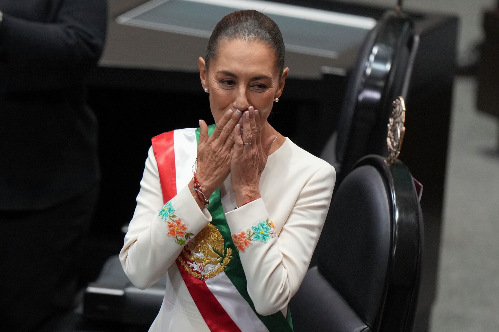 Claudia Sheinbaum blows a kiss during her swearing-in ceremony as Mexico's new president at Congress in Mexico City, Tuesday, Oct. 1, 2024. (AP Photo/Fernando Llano)