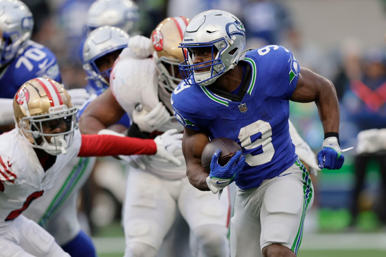 Seattle Seahawks running back Kenneth Walker III (9) runs during the first half of an NFL football game against the San Francisco 49ers, Thursday, Oct. 10, 2024, in Seattle. (AP Photo/John Froschauer)