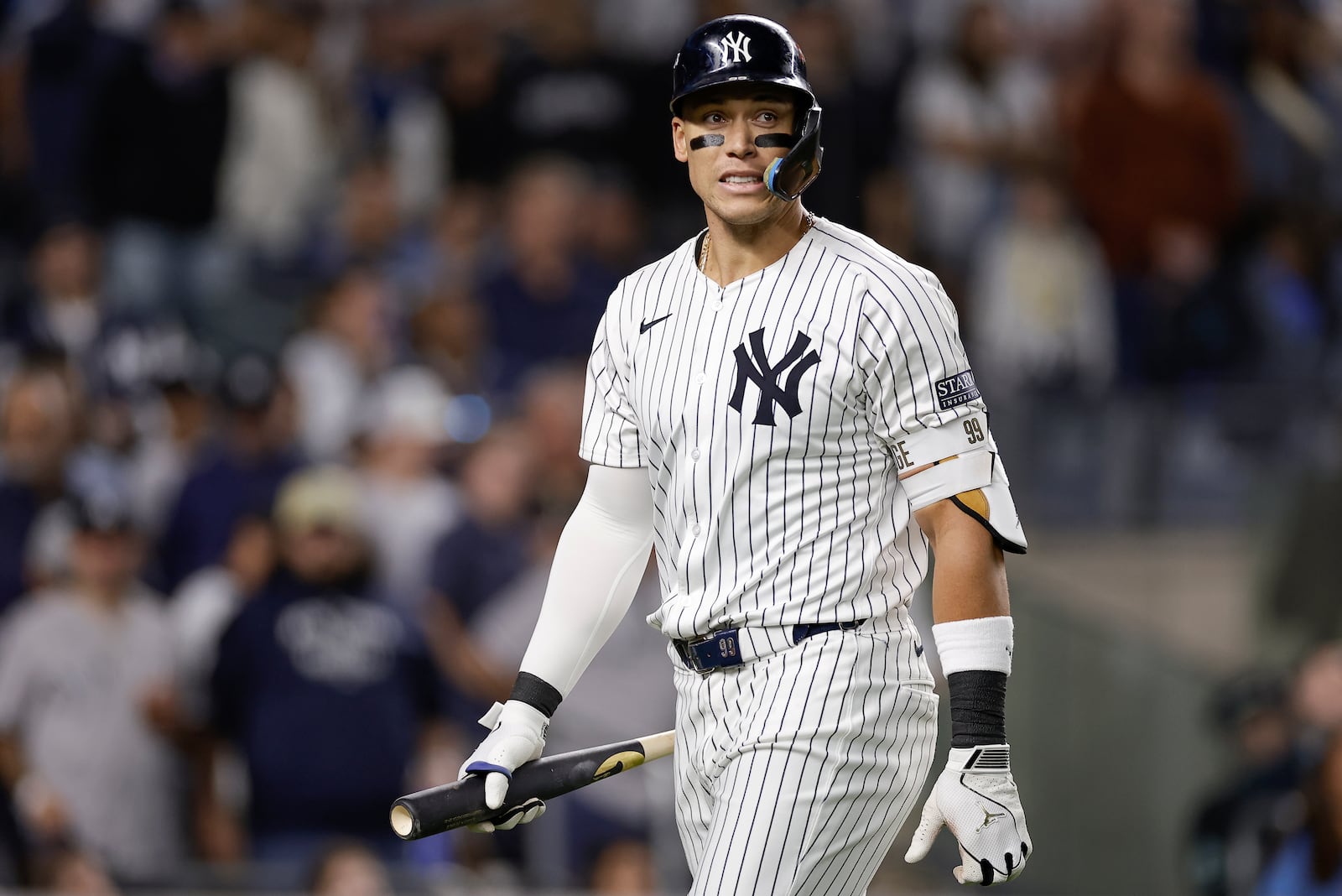 New York Yankees outfielder Aaron Judge (99) reacts after striking out against the Kansas City Royals during the sixth inning of Game 1 of the American League baseball division series, Saturday, Oct. 5, 2024, in New York. (AP Photo/Adam Hunger)