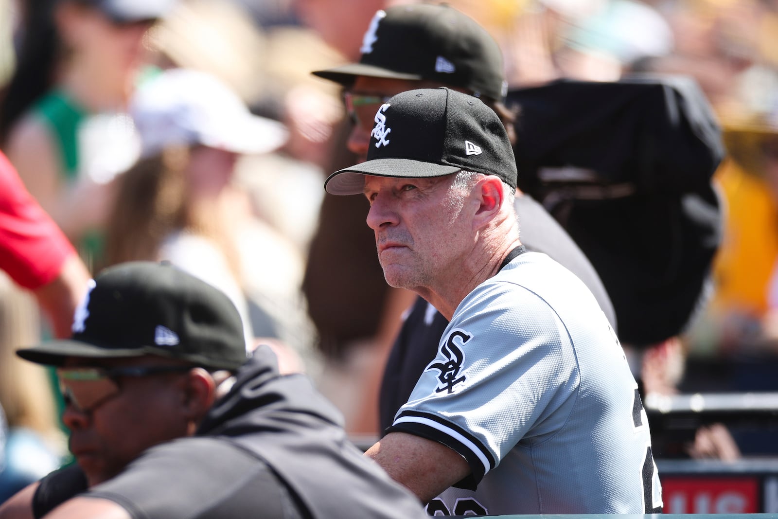 Chicago White Sox bench coach Doug Sisson, right, looks on from the dugout during a baseball game against the San Diego Padres, Sunday, Sept. 22, 2024, in San Diego. (AP Photo/Derrick Tuskan)