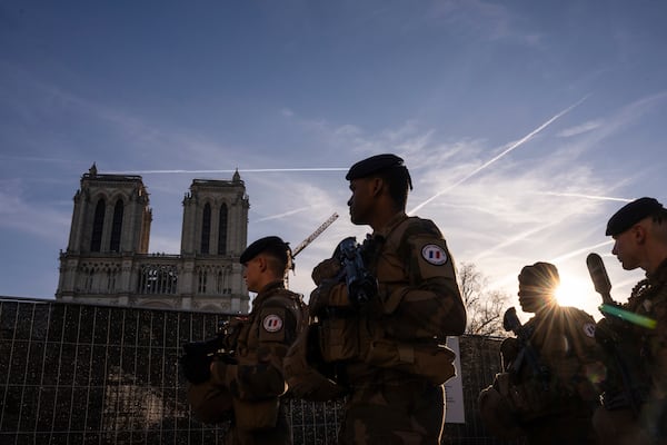 France's anti-terror Sentinelle operation soldiers patrol as French President Emmanuel Macron visits the renovated Notre Dame Cathedral in Paris, Friday, Nov. 29, 2024. (AP Photo/Louise Delmotte)