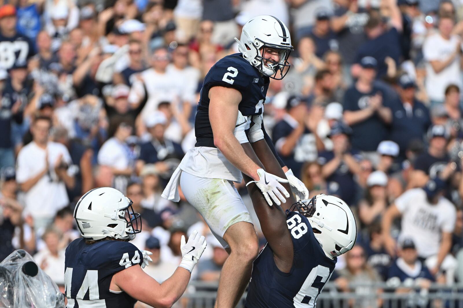 Penn State wide receiver Liam Clifford (2) celebrates after a touchdown pass with offensive lineman Anthony Donkoh (68) during the second quarter of an NCAA college football game against Kent State, Saturday, Sept. 21, 2024, in State College, Pa. (AP Photo/Barry Reeger)