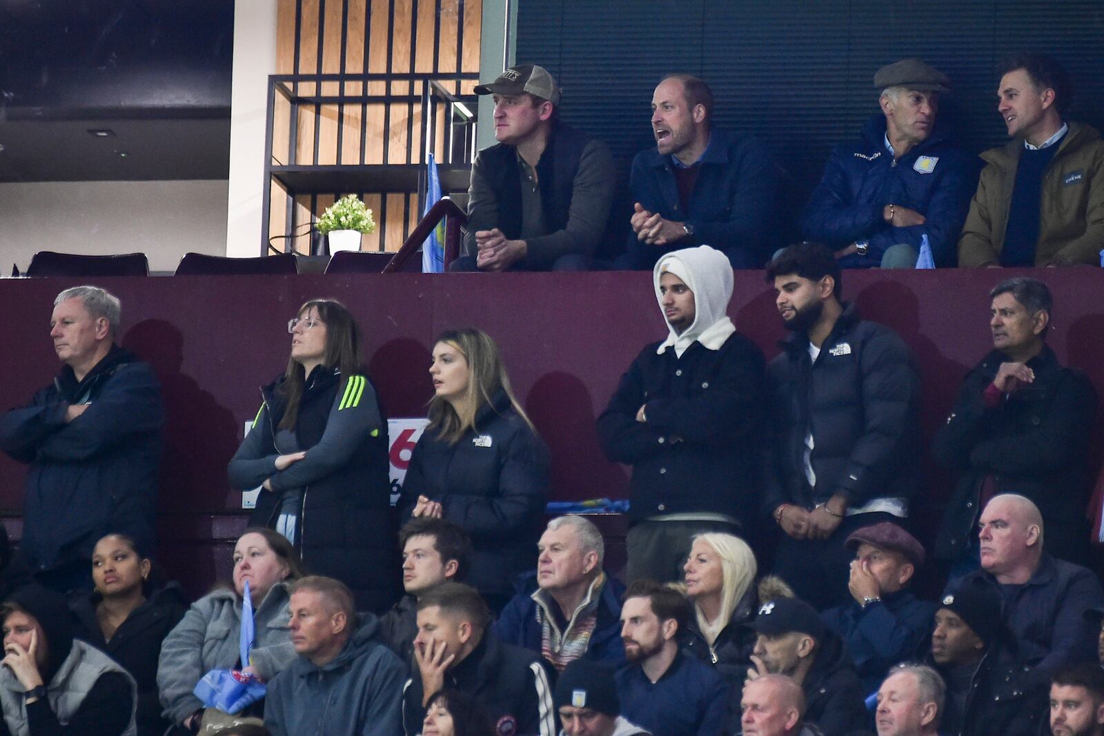 Britain's Prince William, second left in back row, reacts during the Champions League opening phase soccer match between Aston Villa and Bayern Munich, at Villa Park in Birmingham, England, Wednesday, Oct. 2, 2024. (AP Photo/Rui Vieira)