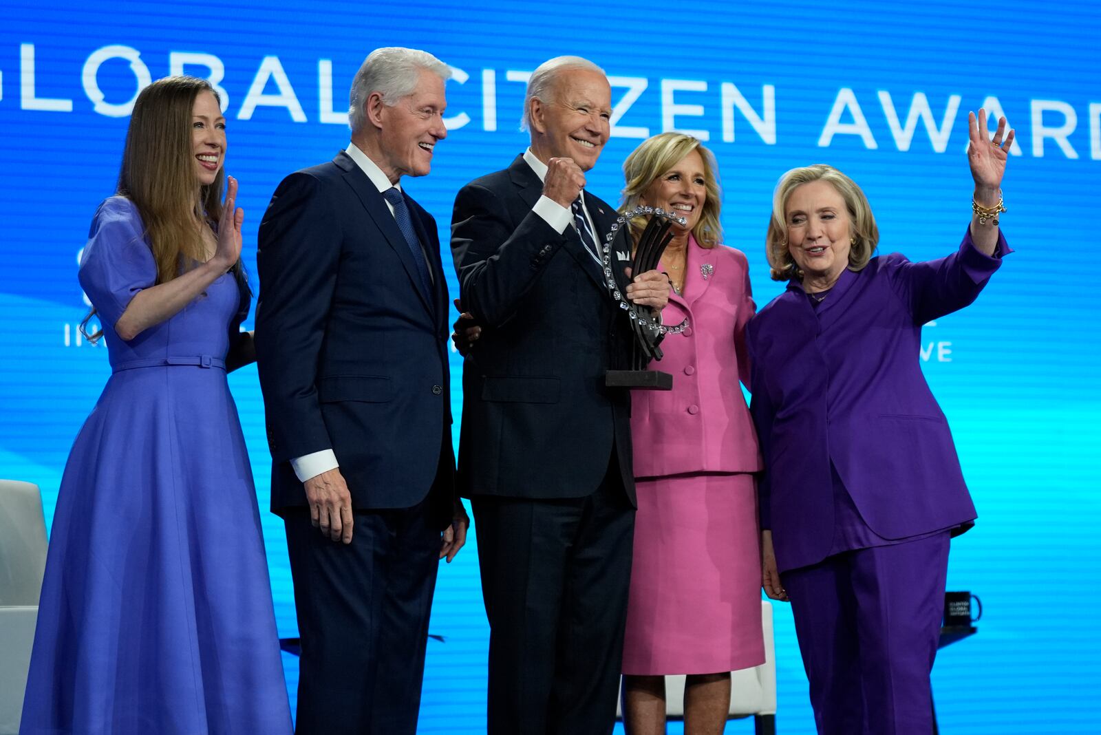 President Joe Biden is presented with the Global Citizen Award by Chelsea Clinton, former President Bill Clinton, first lady Jill Biden and former Secretary of State Hillary Clinton at the Clinton Global Initiative Monday, Sept. 23, 2024, in New York. (AP Photo/Manuel Balce Ceneta)