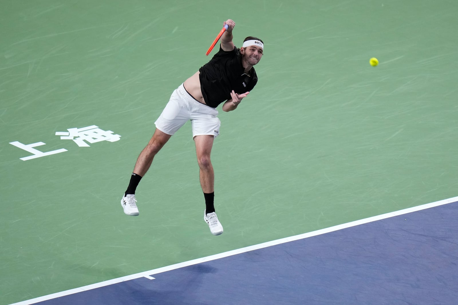 Taylor Fritz of the United States serves against Terence Atmane of France during the men's singles second round match in the Shanghai Masters tennis tournament at Qizhong Forest Sports City Tennis Center in Shanghai, China, Monday, Oct. 7, 2024. (AP Photo/Andy Wong)