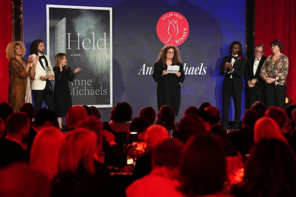 Anne Michaels accepts the Giller Prize for her book "Held" at a ceremony in Toronto, Monday, Nov. 18, 2024. (Chris Young/The Canadian Press via AP)