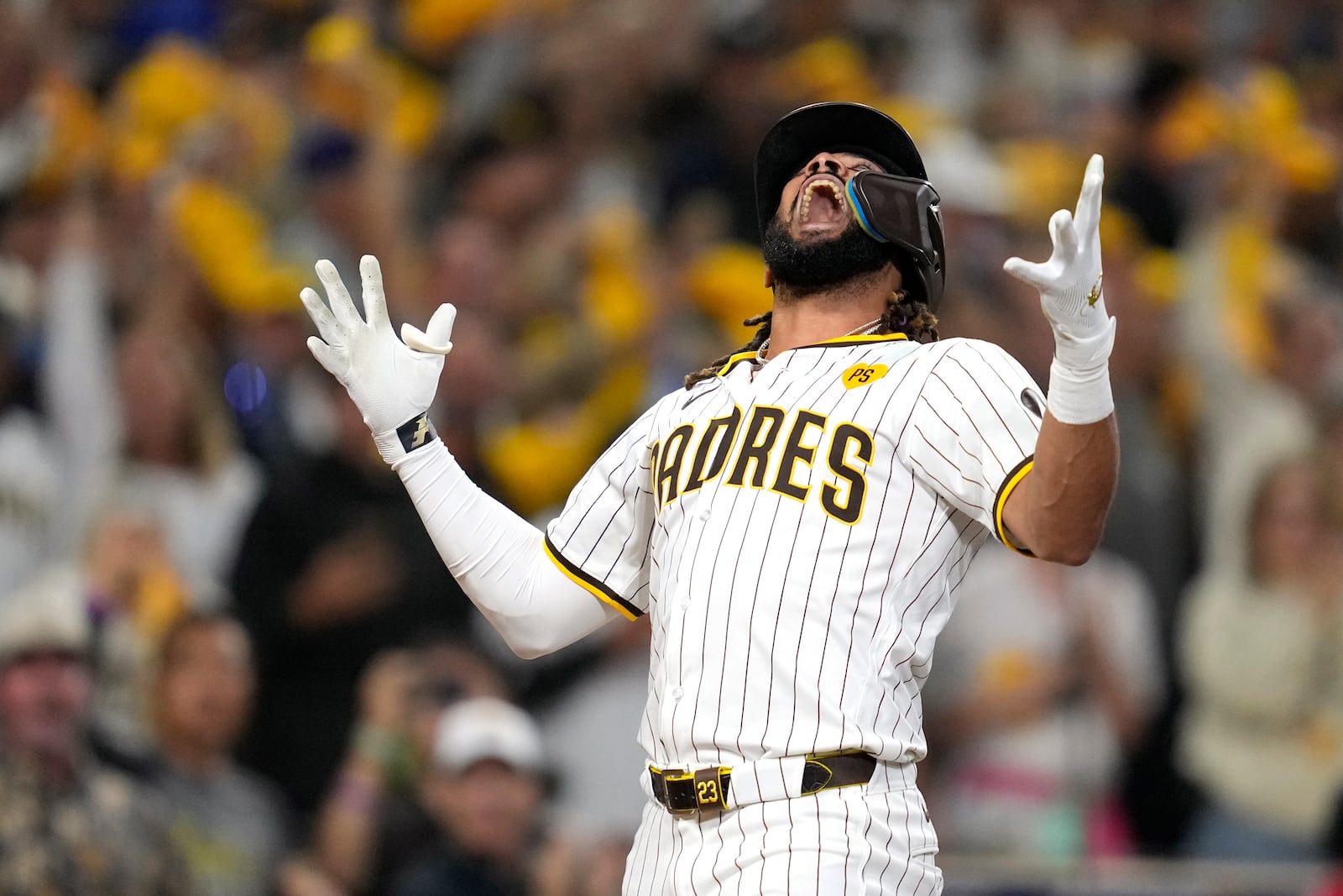 San Diego Padres' Fernando Tatis Jr. celebrates after hitting a two-run home run during the second inning in Game 3 of a baseball NL Division Series against the Los Angeles Dodgers, Tuesday, Oct. 8, 2024, in San Diego. (AP Photo/Ashley Landis)