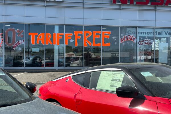 FILE - A Tariff Free sign to attract vehicle shoppers is at an automobile dealership in Totowa, N.J., on April 30, 2025. (AP Photo/Ted Shaffrey)