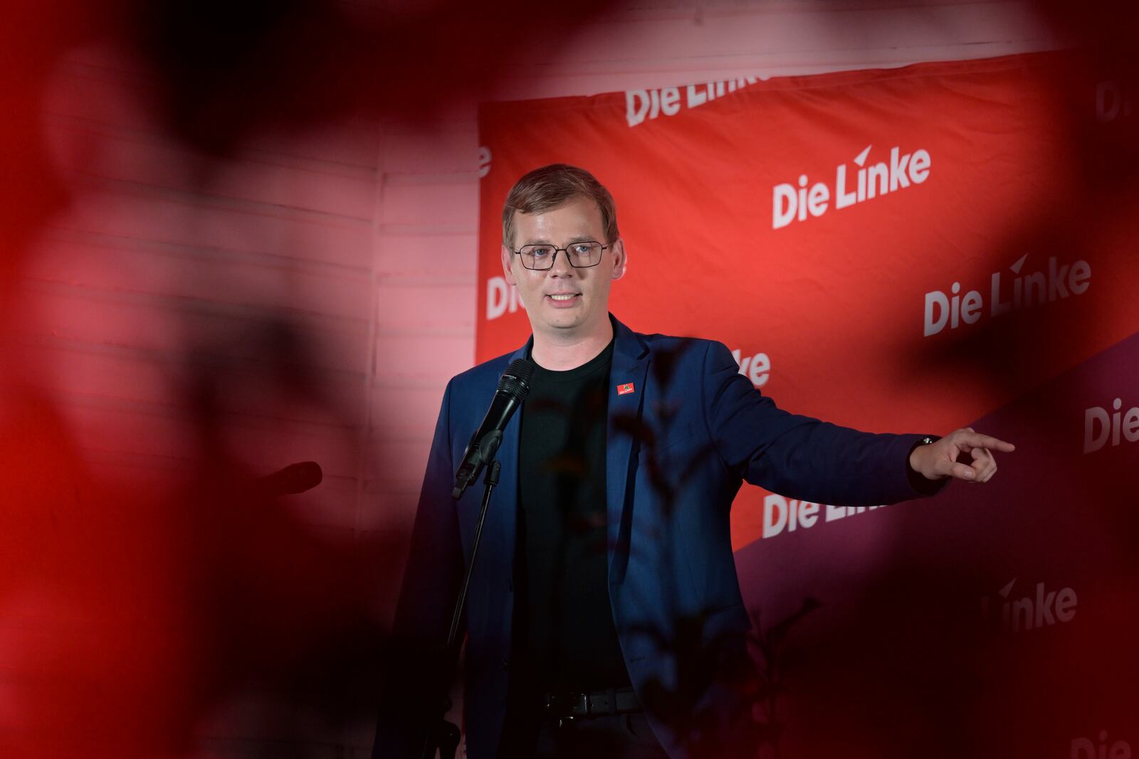 Sebastian Walter, top candidate for the Left Party in Brandenburg, speaks on stage at the election party of the Left Party in Potsdam, Sunday, Sept. 22, 2024. Photo: Michael Bahlo/dpa via AP)