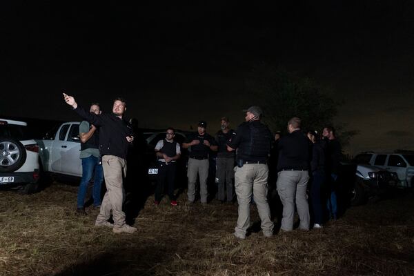 Members of Afriforum, a neighborhood and farm security group, assemble before a patrol in Bashewa area in the east of Pretoria, South Africa, Thursday, March 29, 2025. (AP Photo/Alet Pretorius)