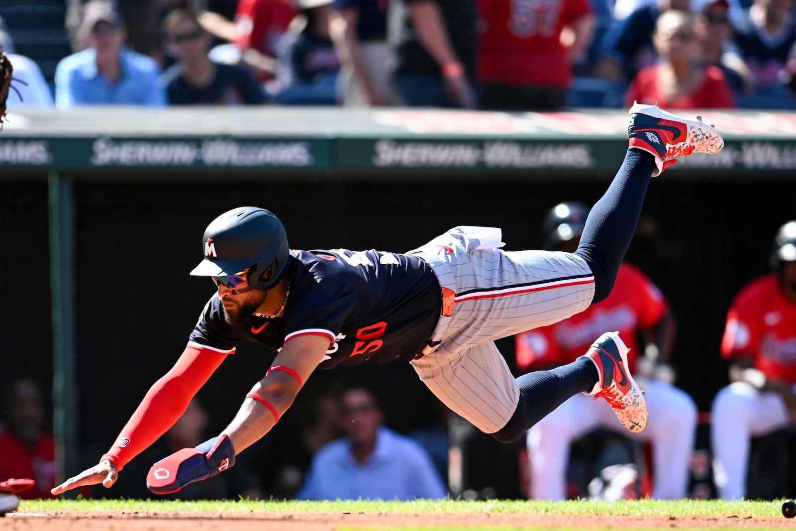 Minnesota Twins' Willi Castro scores on a two-run double hit by Manuel Margot during the fifth inning of a baseball game against the Cleveland Guardians, Thursday, Sept. 19, 2024, in Cleveland. (AP Photo/Nick Cammett)