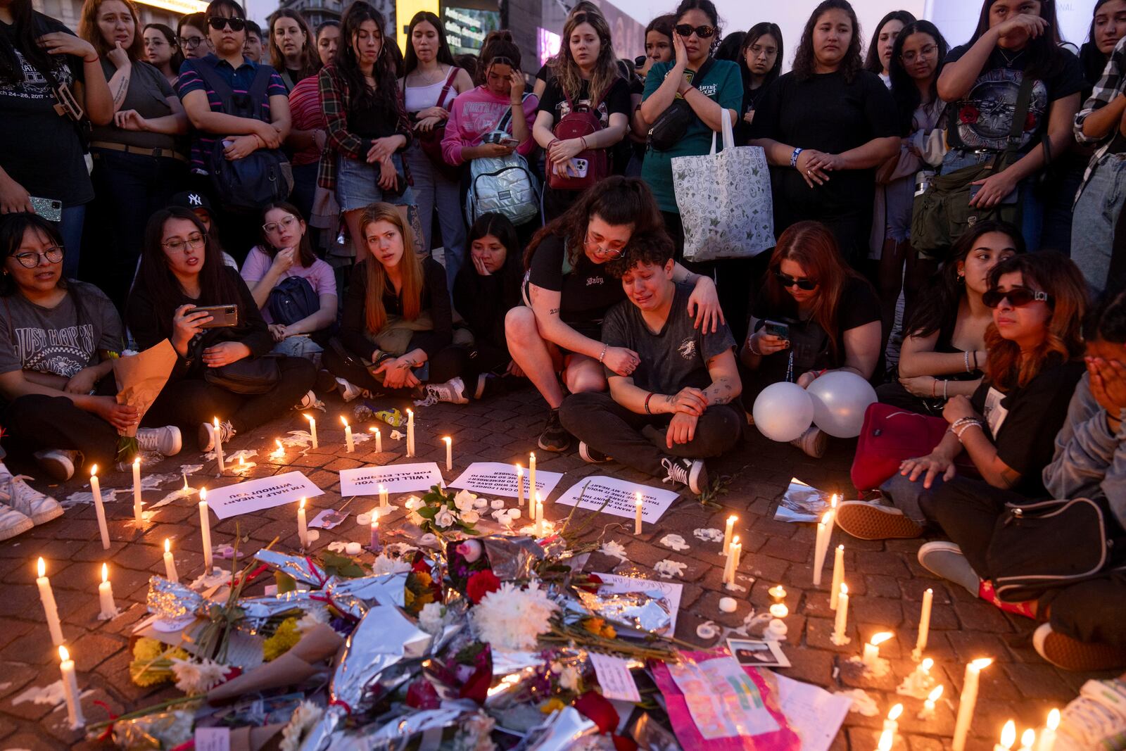 Fans of former One Direction singer Liam Payne gather at the Obelisk to honor him one day after he was found dead at an hotel in Buenos Aires, Argentina, Thursday, Oct. 17, 2024. (AP PhotoVictor R. Caivano)