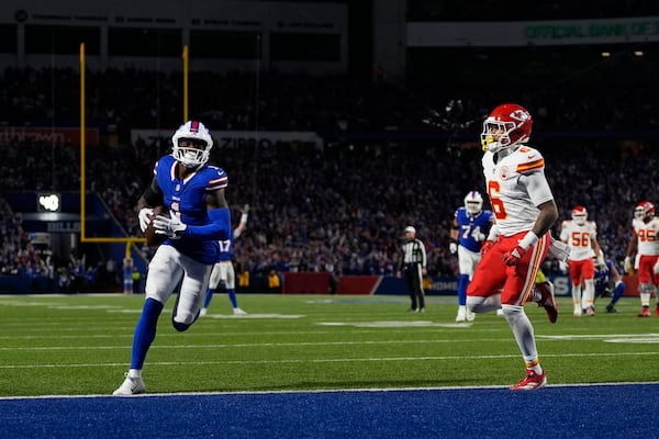 Buffalo Bills wide receiver Curtis Samuel scores past Kansas City Chiefs safety Bryan Cook (6) during the second half of an NFL football game Sunday, Nov. 17, 2024, in Orchard Park, N.Y. (AP Photo/Julia Demaree Nikhinson)