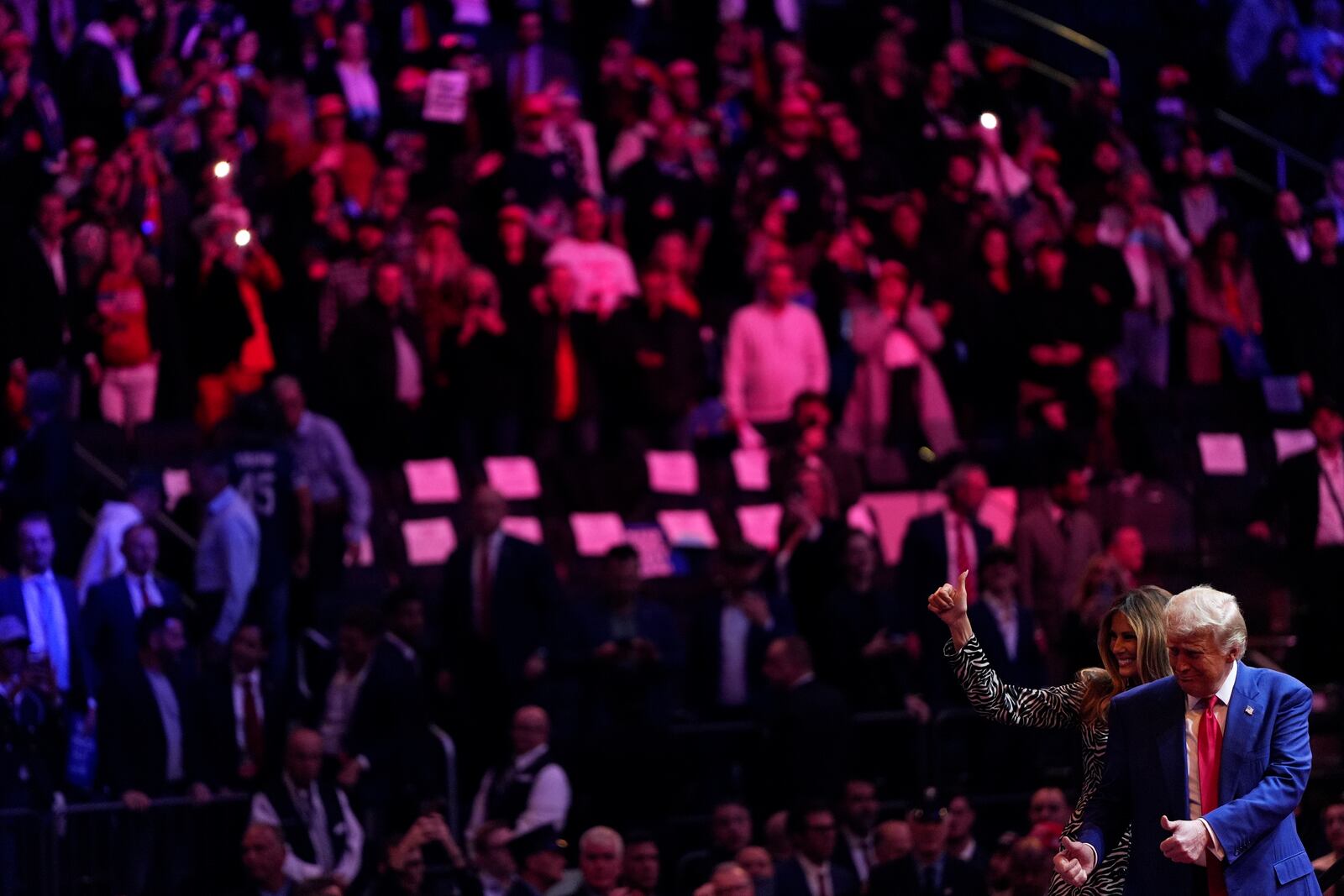 Republican presidential nominee former President Donald Trump and former first lady Melania Trump greet the crowd together during a campaign rally at Madison Square Garden, Sunday, Oct. 27, 2024, in New York. (AP Photo/Julia Demaree Nikhinson)