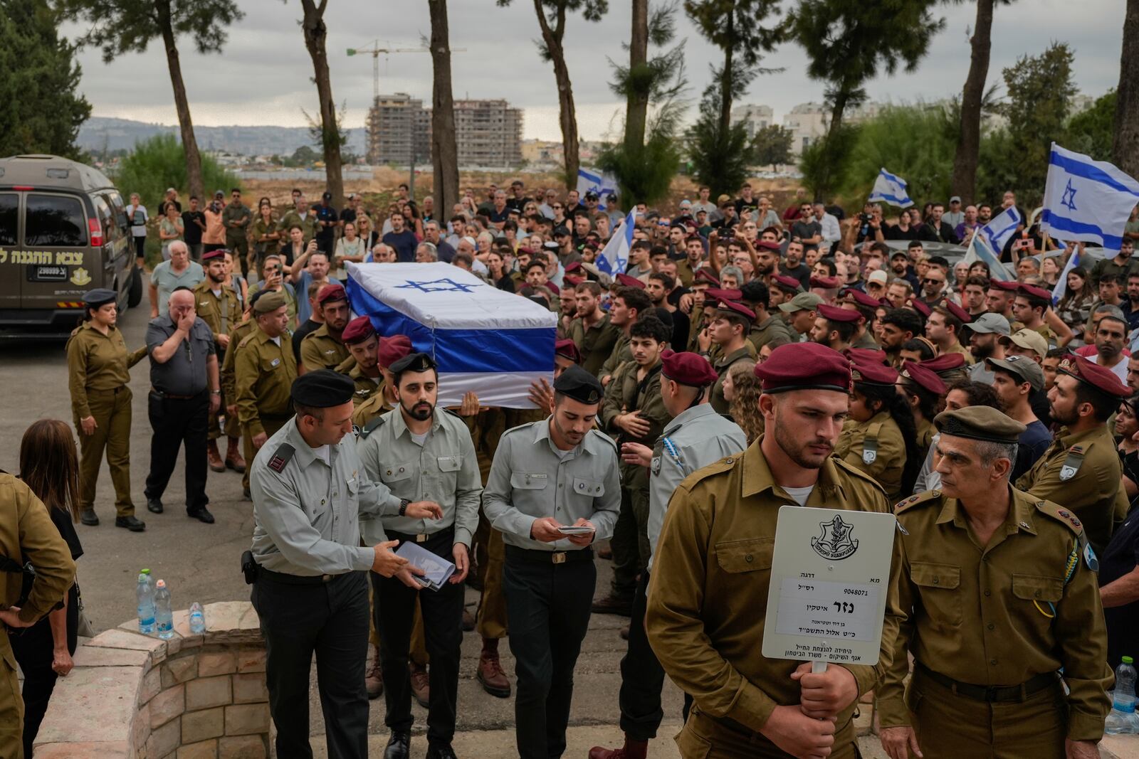 Israeli soldiers carry the flag-draped casket of Sgt. First Class Nazar Itkin, who was killed during Israel's ground operation against Hezbollah militants in Lebanon, during his funeral in Kiryat Ata, Israel, Sunday, Oct. 6, 2024. (AP Photo/Baz Ratner)