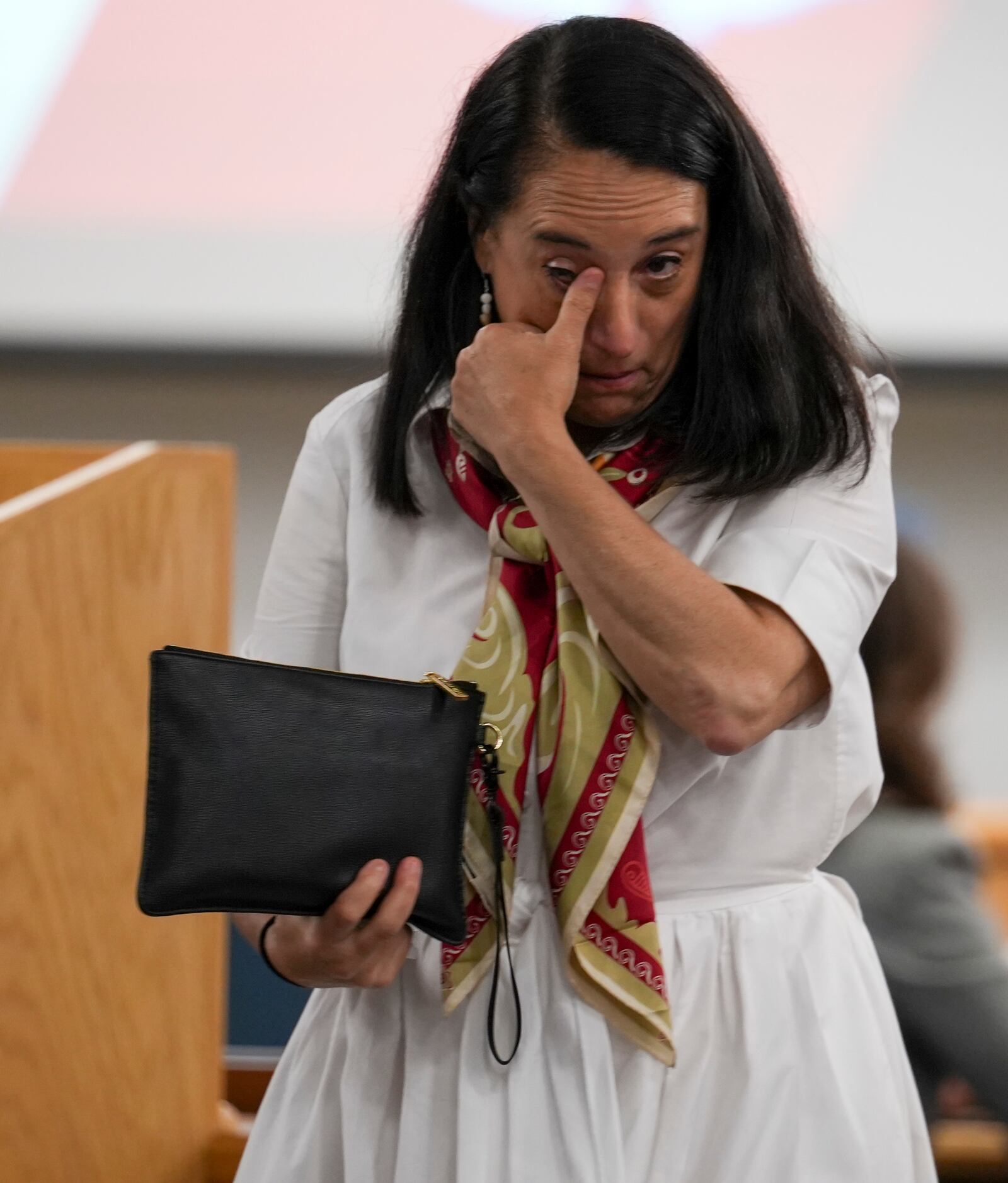 Renata Rojas, OceanGate mission specialist, wipes tears away during testimony at the Titan marine board formal hearing inside the Charleston County Council Chambers Thursday, Sept. 19, 2024, in North Charleston, S.C. (Corey Connor via AP, Pool)