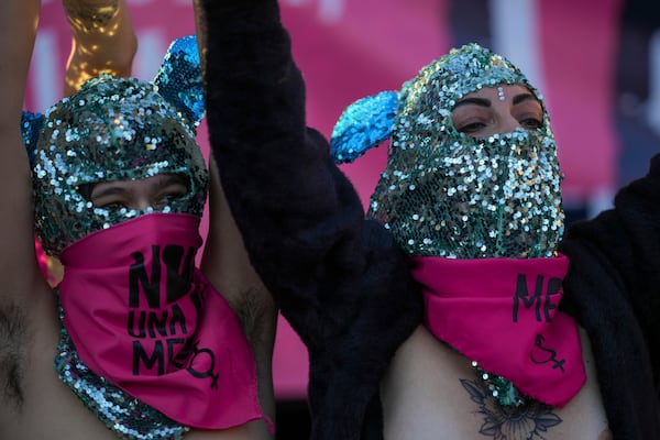 Demonstrators take part in a rally ahead of the International Day for the Elimination of Violence against Women which will held on Nov. 25, in Rome, Saturday, Nov. 23, 2024. (AP Photo/Andrew Medichini)