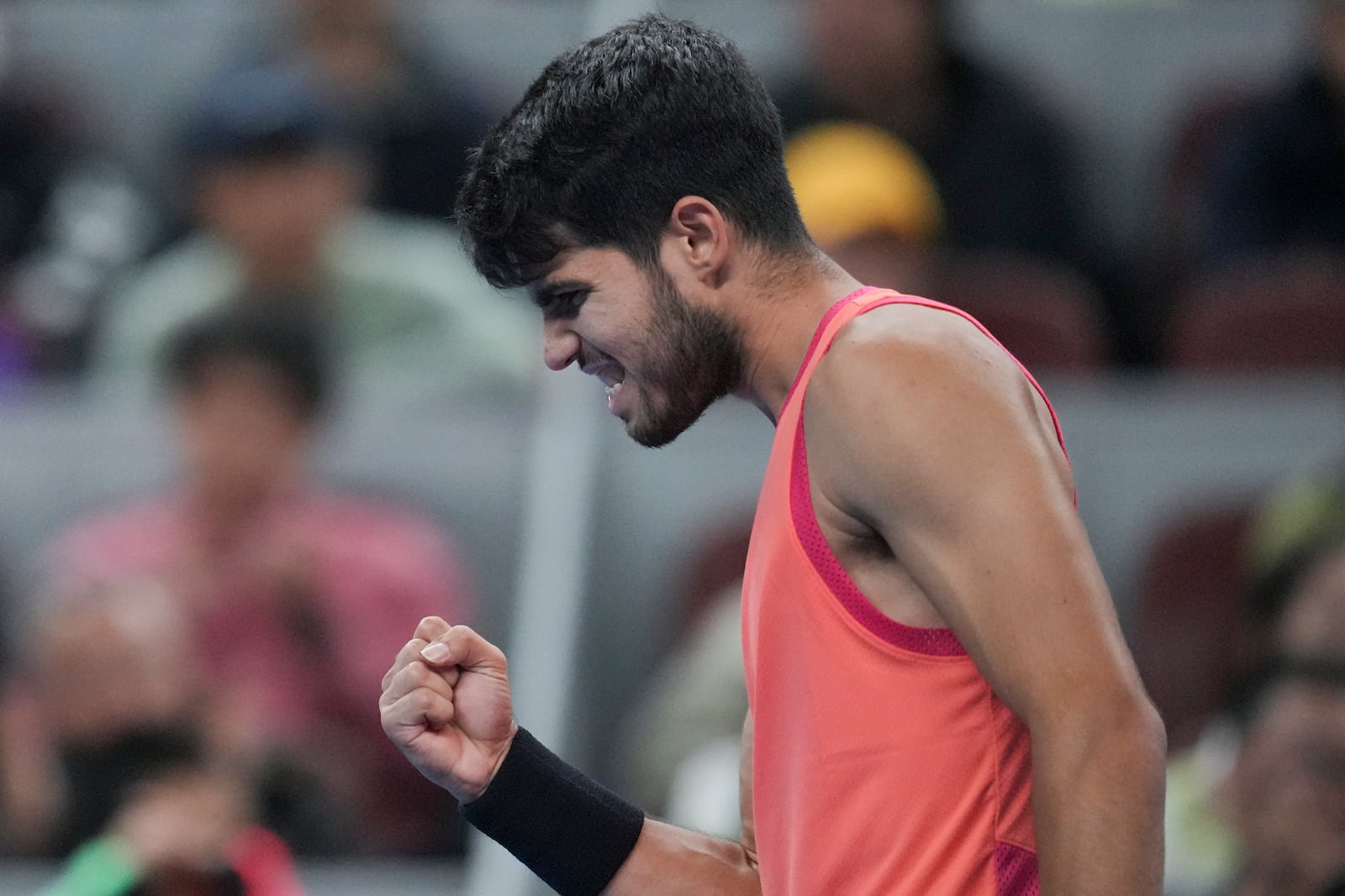 Carlos Alcaraz of Spain reacts during their men's singles finals match against Jannik Sinner of Italy at the China Open tennis tournament, National Tennis Center in Beijing, Wednesday, Oct. 2, 2024. (AP Photo/Achmad Ibrahim)