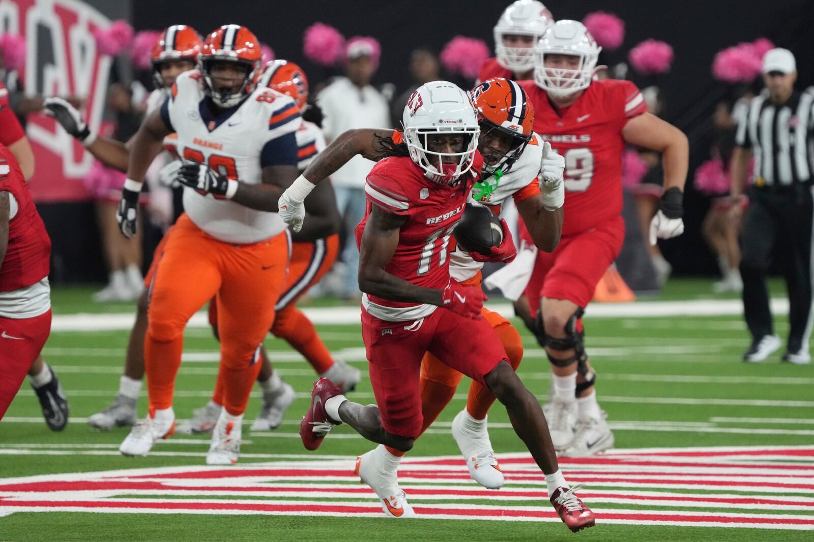 UNLV wide receiver Ricky White III (11) runs after a catch in the first half during an NCAA college football game against Syracuse, Friday, Oct. 4, 2024, in Las Vegas. (AP Photo/Rick Scuteri)