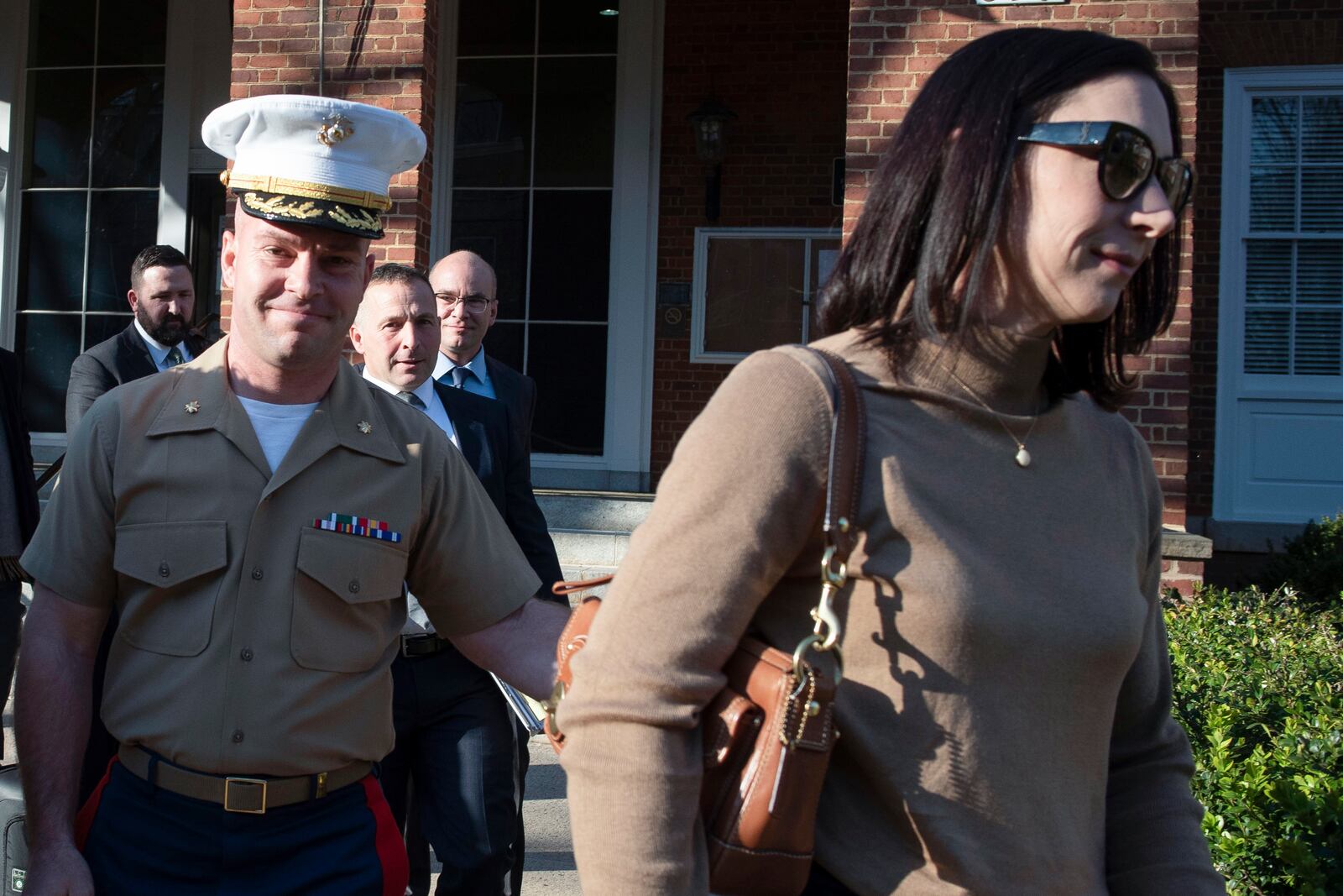 FILE - Marine Maj. Joshua Mast and his wife, Stephanie, walk out of Circuit Court, March 30, 2023 in Charlottesville, Va. A Virginia appellate court ruled Tuesday that a U.S. Marine should never have been granted an adoption of an Afghan war orphan and voided the custody order he’s relied on to raise the girl for nearly three years. The decision marked a major turning point in a bitter custody battle that has international ramifications far greater than the fate of one child. (AP Photo/Cliff Owen, File)