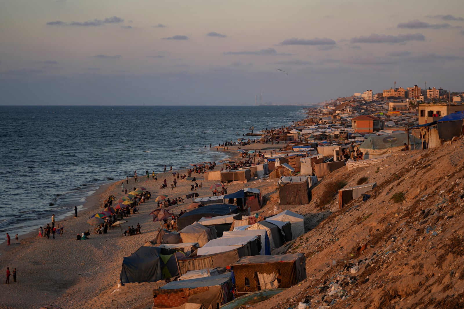 Tents are crammed together as displaced Palestinians camp along the beach of Deir al-Balah, central Gaza Strip, Wednesday, Oct. 9, 2024. (AP Photo/Abdel Kareem Hana)