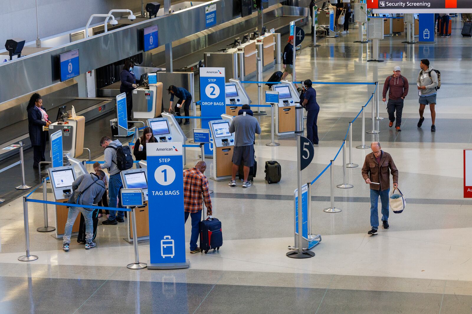 Travelers check in as flights to Tampa, Fla., are canceled due to Hurricane Milton on Wednesday, Oct. 9, 2024 at the Philadelphia International Airport. (Alejandro A. Alvarez/The Philadelphia Inquirer via AP)