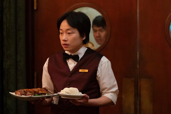 This image released by Hulu shows Jimmy O. Yang in a scene from the series "Interior Chinatown." (Mike Taing/Hulu via AP)