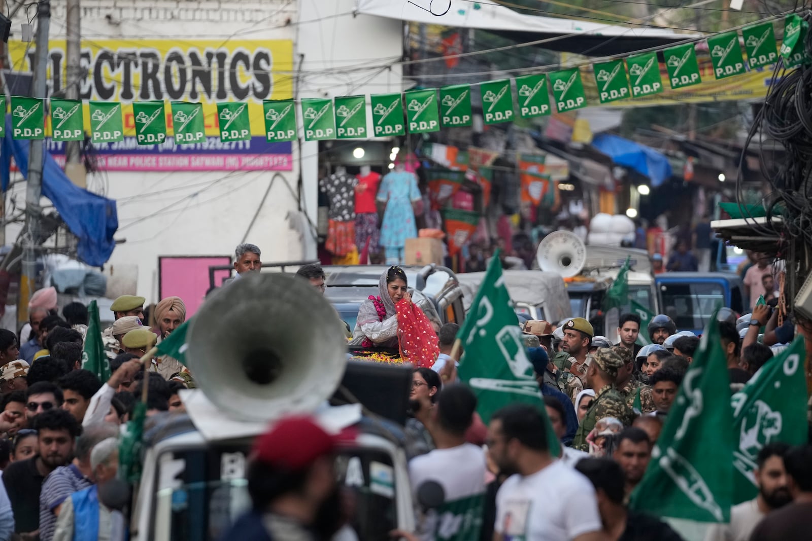 FILE- Mehbooba Mufti, leader of the Peoples Democratic Party (PDP), greets supporters during a campaign rally of Jammu and Kashmir Assembly elections in Jammu, India, Sept. 25, 2024. (AP Photo/Channi Anand, File)