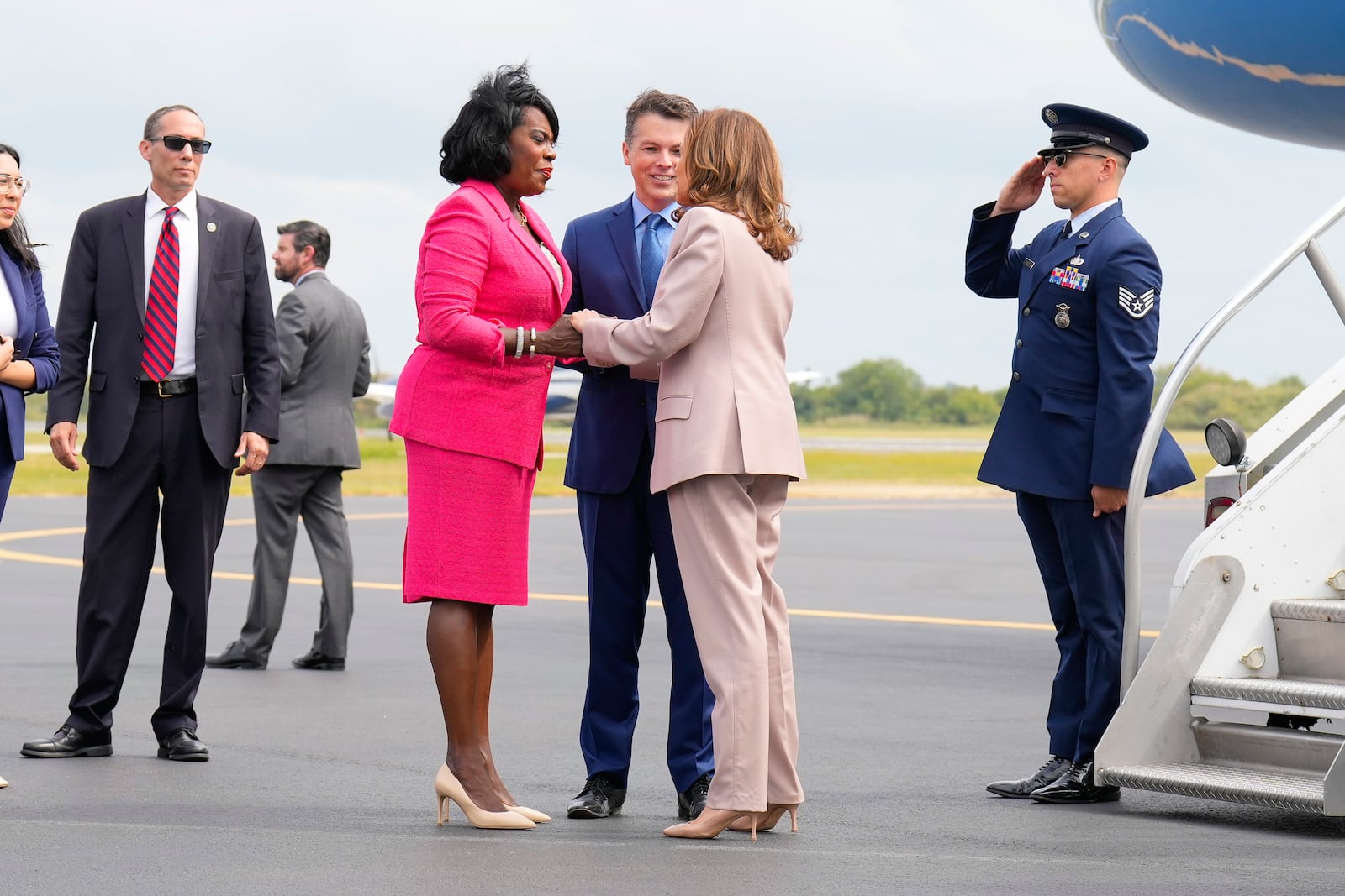 Democratic presidential nominee Vice President Kamala Harris is greeted by Philadelphia Mayor Cherelle Lesley Parker, left, and Rep. Brendan Boyle, D-PA., center, on the tarmac at Atlantic Aviation Philadelphia, Monday, Sept. 9, 2024, near Philadelphia International Airport, in Philadelphia, Tuesday, Sept. 17, 2024. (AP Photo/Jacquelyn Martin)