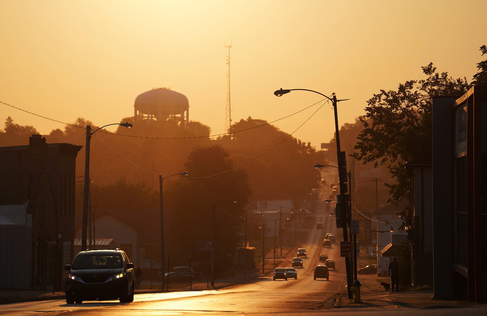 The sun rises over the city of Springfield, Ohio, Monday, Sept. 16, 2024. (AP Photo/Jessie Wardarski)