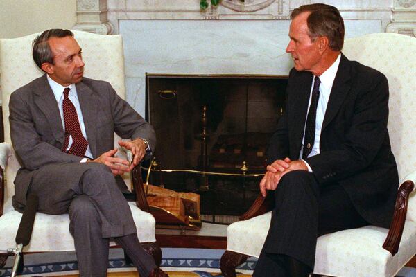 FILE - President George H.W. Bush talks with Supreme Court nominee Judge David Souter in the Oval Office of the White House, Sept. 13, 1990. (AP Photo/Charles Tasnadi, File)