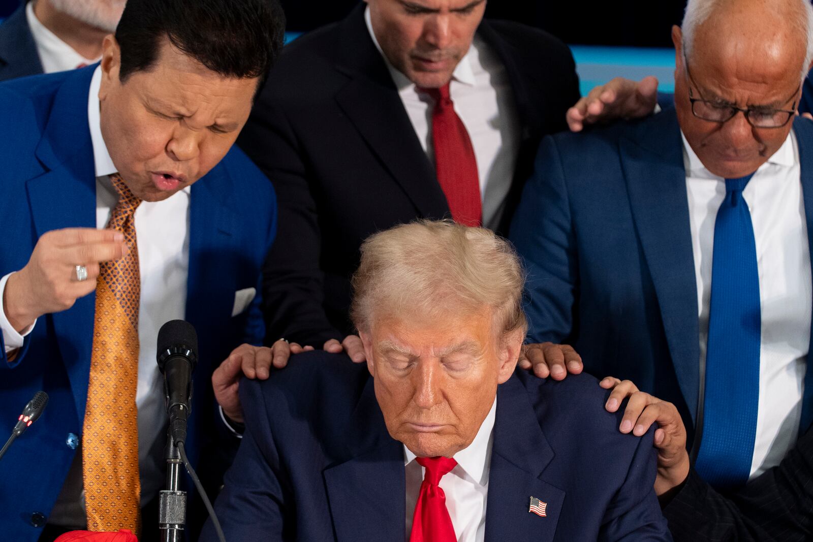 Latino leaders pray with Republican presidential nominee former President Donald Trump as he participates in a Latino leader roundtable, Tuesday, Oct. 22, 2024 in Doral, Fla. (AP Photo/Alex Brandon)