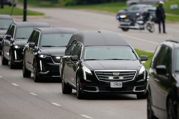 A funeral procession leaves Congregation Beth Torah after a funeral for Sarah Milgrim, a staffer at the Israeli Embassy who was killed last week outside a Washington Jewish museum, Tuesday, May 27, 2025, in Overland Park, Kan. (AP Photo/Charlie Riedel)