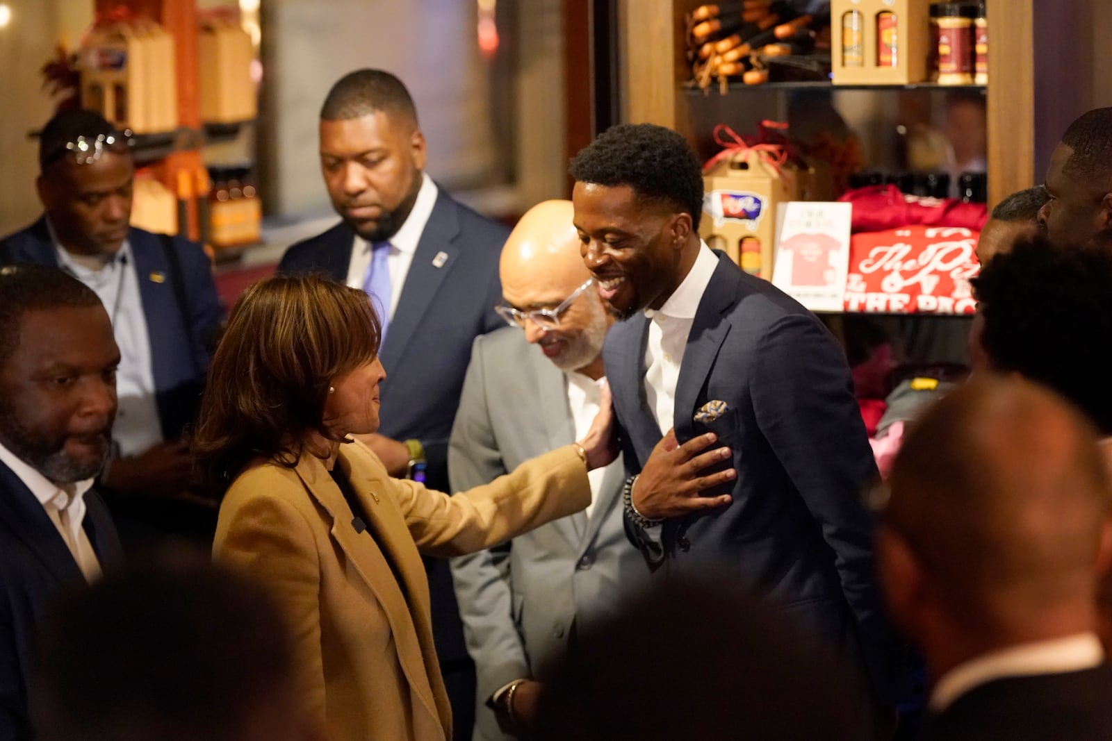 Democratic presidential nominee Vice President Kamala Harris, left, greets guests as she visits The Pit Authentic Barbecue to learn about the restaurant's relief efforts for Hurricane Helene, in Raleigh, N.C., Saturday, Oct. 12, 2024. (AP Photo/Steve Helber)