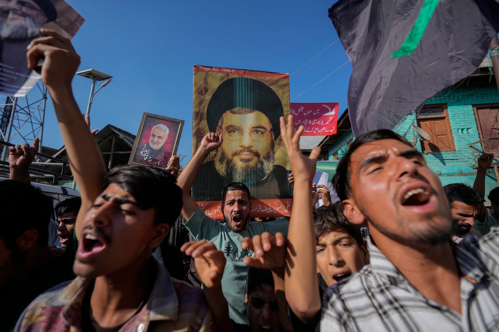 Kashmiri Shiite Muslims shout pro-Palestine and anti-Israel slogans during a protest in solidarity with Palestine and against the killing of Hezbollah leader Hassan Nasrallah, at Mirgund north village of Srinagar, Indian controlled Kashmir, Friday, Oct. 4, 2024. (AP Photo/Mukhtar Khan)