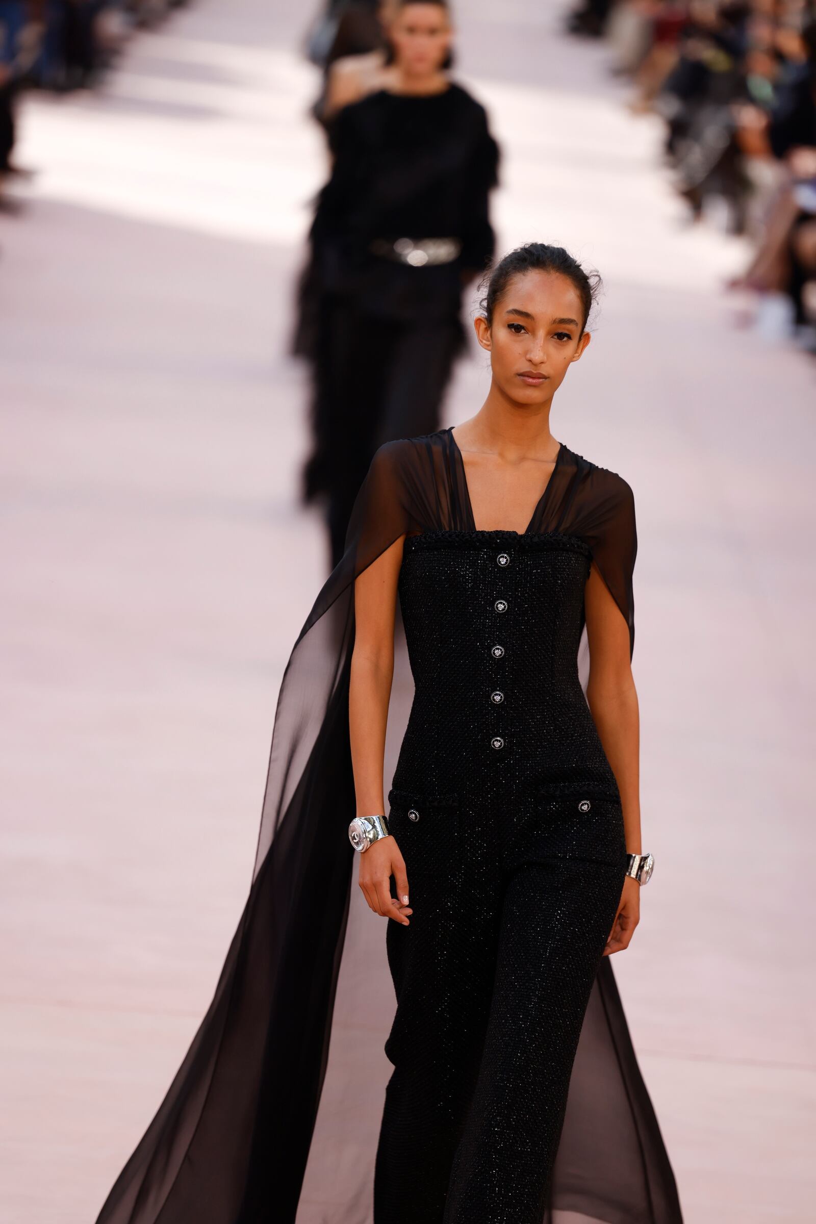 A model wears a creation as part of the Chanel Spring/Summer 2025 collection presented Tuesday, Oct. 1, 2024, in Paris. (Photo by Vianney Le Caer/Invision/AP)