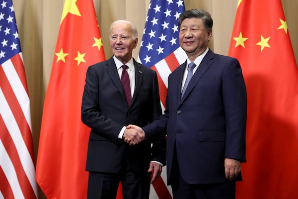 President Joe Biden shakes hands with Chinese President Xi Jinping before a bilateral meeting, Saturday, Nov. 16, 2024, in Lima, Peru. (Leah Millis/Pool Photo via AP)