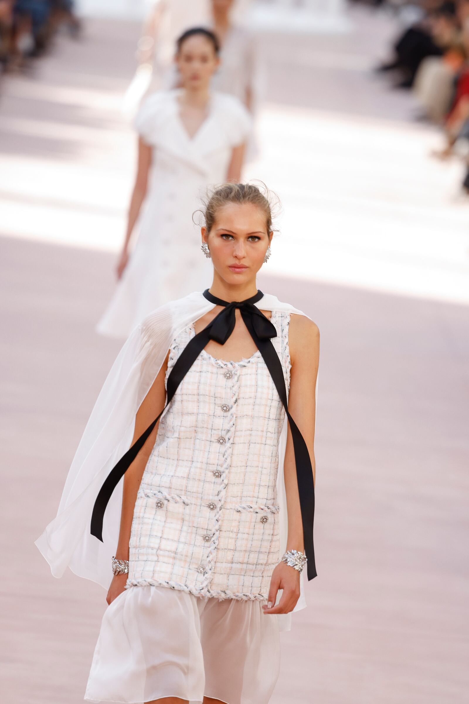 Models wear creations as part of the Chanel Spring/Summer 2025 collection presented Tuesday, Oct. 1, 2024, in Paris. (Photo by Vianney Le Caer/Invision/AP)