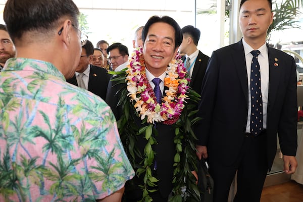 Taiwan President Lai Ching-te, center, arrives at the Kahala Hotel and Resort Saturday, Nov. 30, 2024 in Honolulu. (AP Photo/Marco Garcia)